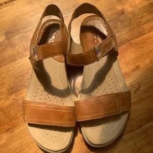 Ecco sandals in tan leather.